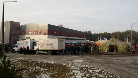 Grodno, Belarus, December, 3, 2021. Migrant camp at the Polish-Belarus boarder. Inside and outside the camp. Daily routines
