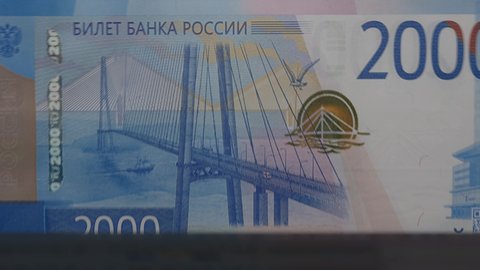 Russian rubles banknotes in cash machine. 2000 rubles counting video.