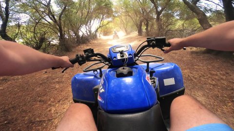 Driving a Quad ATV on off-road in Spain. Point of view, POV driving a quad. Off-road adventures on ATVs.