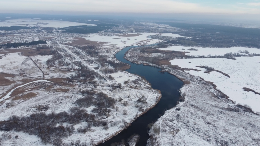 River in winter. Snow and river