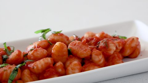Eating Gnocchi and Tomato Sauce