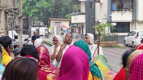 Mumbai, India 11th December 2021:  Jain. Jain marasaheb. Auspicious religious event. Jainism. Jain sadhu sadhvi. Monks and nuns.Vandana and welcoming of religious Guru’s. jain dharma