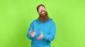 Redhead man with long beard applauding after presentation in a conference over isolated background