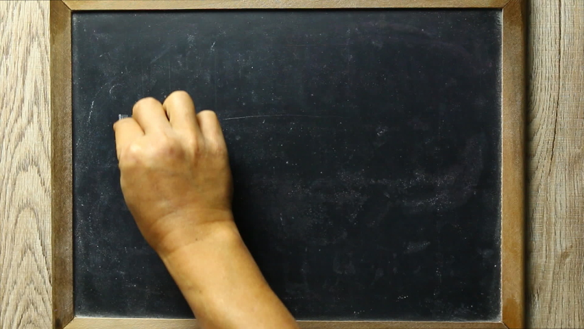 Man is writing mathematics  equation on blackboard, in studio Chiangmai Thailand.