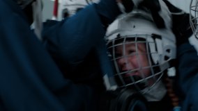 Kids cheering their teammate girl after scoring a goal during ice hockey game. Shot with 2x anamorphic lens - Powered by Shutterstock - Get 15% off with code: PIKWIZARD15