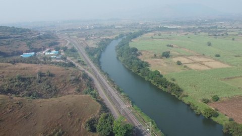 Aerial view of river Indrayani and railway infrastructure along the river at Kamshet near Pune India.