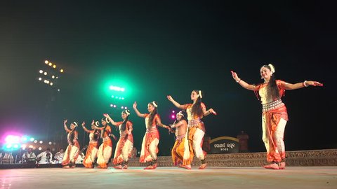 KONARK, INDIA - 3 DECEMBER 2014: A group of female dancers performs a show during the annual Konark Dance Festival in Odisha province, India.