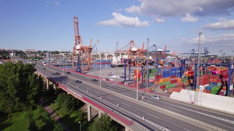 Port of Gdynia. Seaport, containers, container ships and sea transport from the bird's eye view on a sunny day.