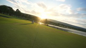 4K Group of Asian people businessman and senior CEO enjoy outdoor sport lifestyle golfing together at golf country club. Healthy men golfer walking on fairway with talking together at summer sunset - Powered by Shutterstock - Get 15% off with code: PIKWIZARD15