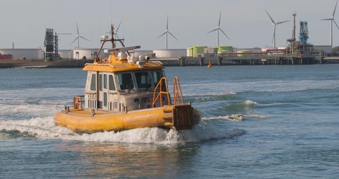 Rotterdam, The Netherlands - Circa 2019: Rotterdam Port Authority boat coming back from patrol, entering the harbor dock at Maasvlakte