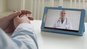 One Person Talking Online with a Doctor About Medication, Using Electronic Tablet Technology and a Video Application.