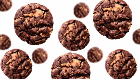 A stream of Collection chocolate chip cookies of different diameters diameters on a white color background. 4K UHD footage. Futuristic design, motion design animation. Pop art design, creative Christm
