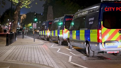 LONDON - NOVEMBER 5, 2021: A line of police vans on Whitehall at The Million Mask March