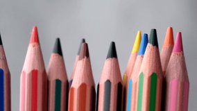Colored pencils move slowly chaotically, sharpened ends up on a gray background, close-up, slow motion, video clip - Powered by Shutterstock - Get 15% off with code: PIKWIZARD15