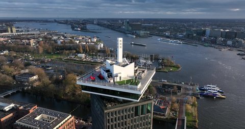 Amsterdam, 8th of December 2021, The Netherlands. Amsterdam Lookout tower. Amsterdam central station and the city skyline in the background.