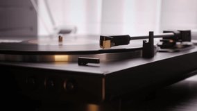 Hand turning off vintage vinyl record. Needle rises from vinyl record turntable. Old turntable. Playing vinyl music - Powered by Shutterstock - Get 15% off with code: PIKWIZARD15