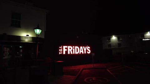 LONDON, UK - 2021: Low aerial shot of a sign for TGI Friday's restaurant 