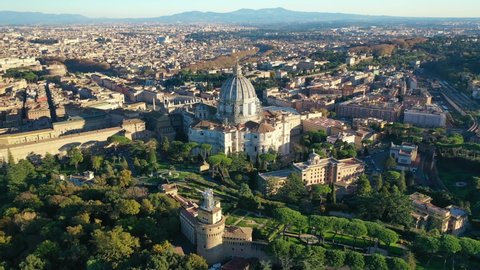 Aerial drone video of iconic Saint Peter Basilica and beautiful Vatican city gardens, Rome, Italy