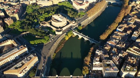 Aerial drone video of iconic Castel Sant'Angelo a fortified medieval castle housing paintings collections in Renaissance style, historic city of Rome, Italy