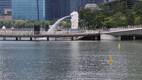 SINGAPORE - 13 DEC 2021: Monday. The Merlion Park has few international tourists as Omincron Covid-19 variant curbs reduce tourism numbers despite the execution of the Vaccinated Travel Lane policy.  