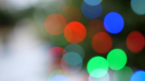 Fairy light on an outdoor Christmas tree festive blurred bokeh abstract background 