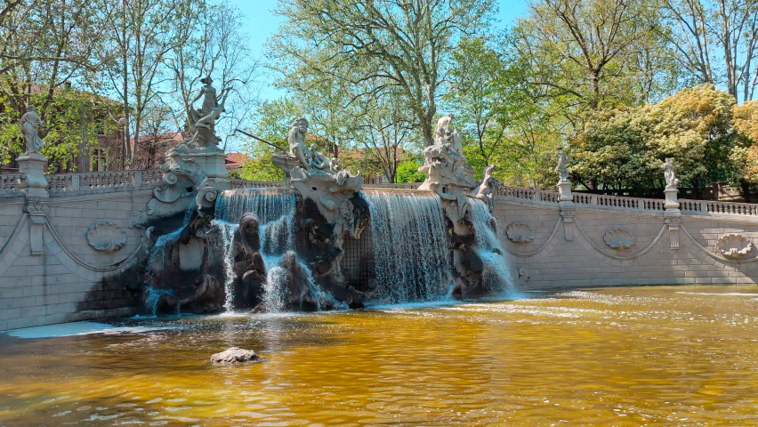 fountain with waterfall in Valentino park in Turin Italy in sunny day