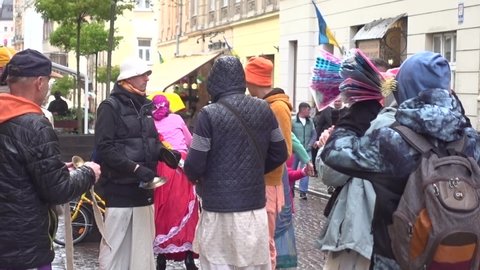 Lviv, Ukraine -27 May 2021:Hare Krishnas sing in the city streets