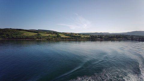 Caledonian MacBrayne ferry sailing to Ardorssan from Brodick port - Isle of Arran - Scotland, United Kingdom - 21st of July 2021