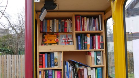 Dec 11, 2021 - Kehl, Germany: A telephone booth containing many free books to exchange. Book lovers concept. Literature in German