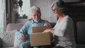 Happy mature aged older family couple unpacking carton box, satisfied with internet store purchase or unexpected gift, feeling excited of fast delivery shipping service, positive shopping experience.
 - Powered by Shutterstock - Get 15% off with code: PIKWIZARD15