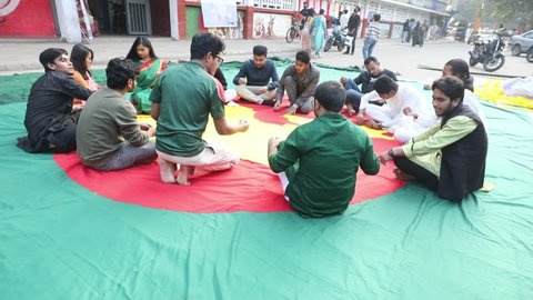 Dhaka, Bangladesh - December 14, 2021: 'Slogan 71' at Dhaka University is making the national flag in the form of the first flag of Bangladesh on the occasion of the golden jubilee of independence.