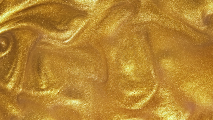 Liquid gold motion organic background. Shine glitter fluid metallic yellow color paint. Texture abstract acrylic cloud swirling underwater. Royalty-Free Stock Footage #1083863953