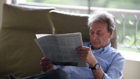 Senior man reading newspaper. older business man reads traditional news - Powered by Shutterstock - Get 15% off with code: PIKWIZARD15
