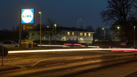Moers , Germany - December 05 2016 : Cars passing the supermarket