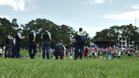 SYDNEY, NSW, AUSTRALIA. DECEMBER 12 2021. Police watch anti vaccine entertainment at rally.