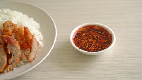 fried pork topped on rice with spicy dipping sauce