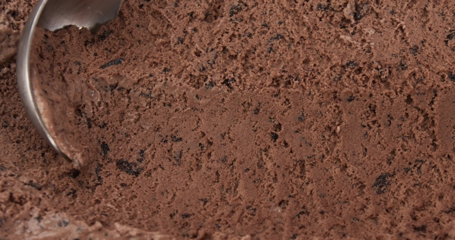 Close up, Scooping chocolate chip ice cream by the spoon. Texture of ice cream texture after scooping. | Shutterstock HD Video #1083894898