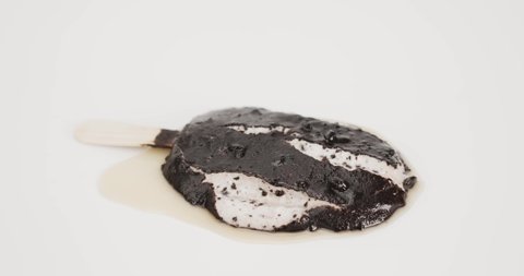 Melted chocolate ice cream sticks on a white background.