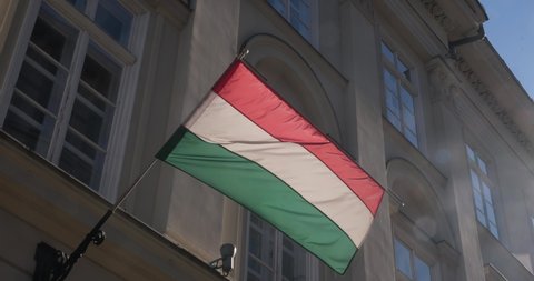 Flag of Hungary on the government building waving in the wind. Hungarian flag footage