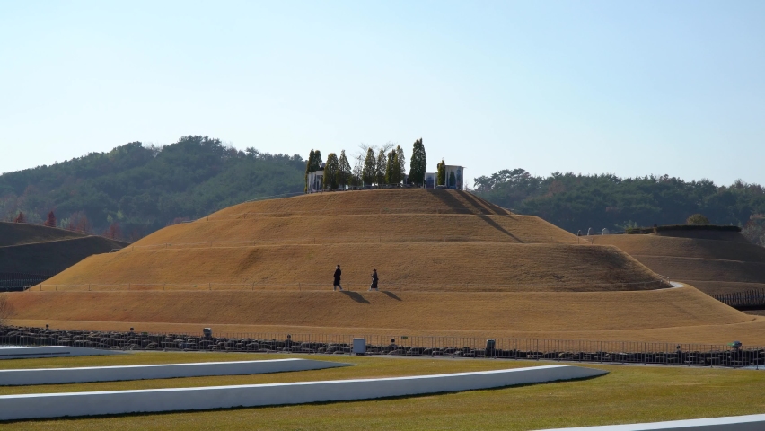 Suncheonman Bay National Garden, Lake Garden - two people strolling around Bonghwa Hill in Autumn - distant wide view
