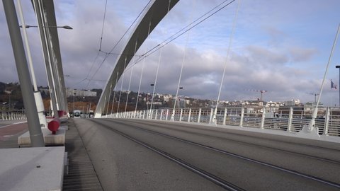 Lyon , France - 12 07 2021: Tram Crossing Tramway On A Bridge Near Confluence. Bridge Raymond-Barre In Lyon, France