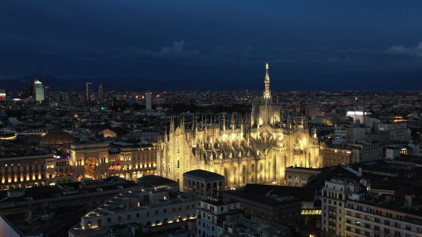 Aerial drone footage of the Milan skyline and the illuminated Dome Cathedral at the night time. Royalty-Free Stock Footage #1083915511