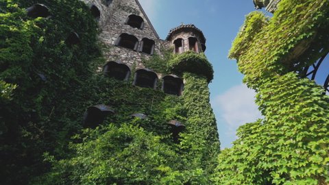 Looking Up At The Exterior Of Ravadinovo Castle Covered In Green Ivy Mantle. Spectacular Attraction Near Sozopol In Bulgaria. low angle, dolly-in
