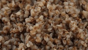 Boiled buckwheat close up, rotation. 4K UHD video