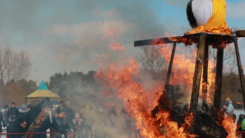 Gomel, Belarus - March 13, 2021: Burning Effigies Straw Maslenitsa In Fire Flame On Traditional National Holiday Dedicated To Approach Of Spring - Slavic Celebration Shrovetide. 4K.
