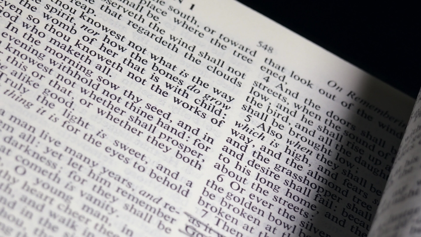 Close Up Bible Page Turning to the book of Isaiah Royalty-Free Stock Footage #1083929779