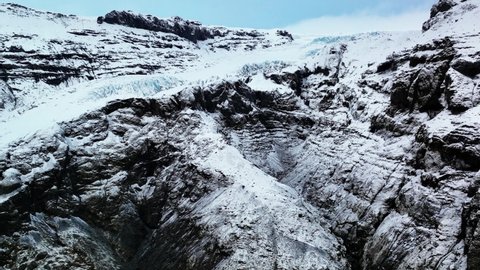 Drone Flight Over Edge Of Glacier Covered In Ice And Snow. Eyjafjallajokull In South Iceland At Winter. aerial