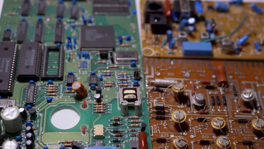 Lots Old Boards with Radio Components, Transistors, Chips, Resistors, Capacitor. Electronic circuit boards of retro TVs with precious metal, gold, platinum, silver, tantalum. Scheme. 4K. Close-up