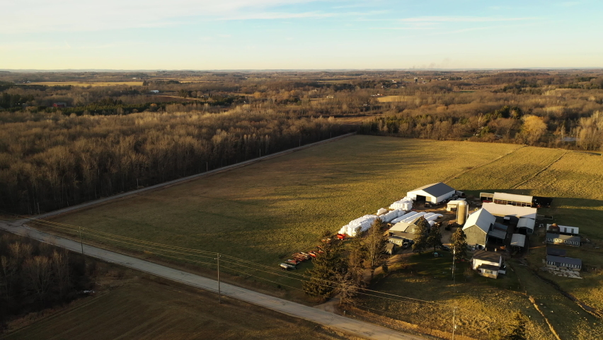 Country winter landscape without snow. Farm, agricultural fields. Aerial overhead view. Midwest USA. Sunset sunlight