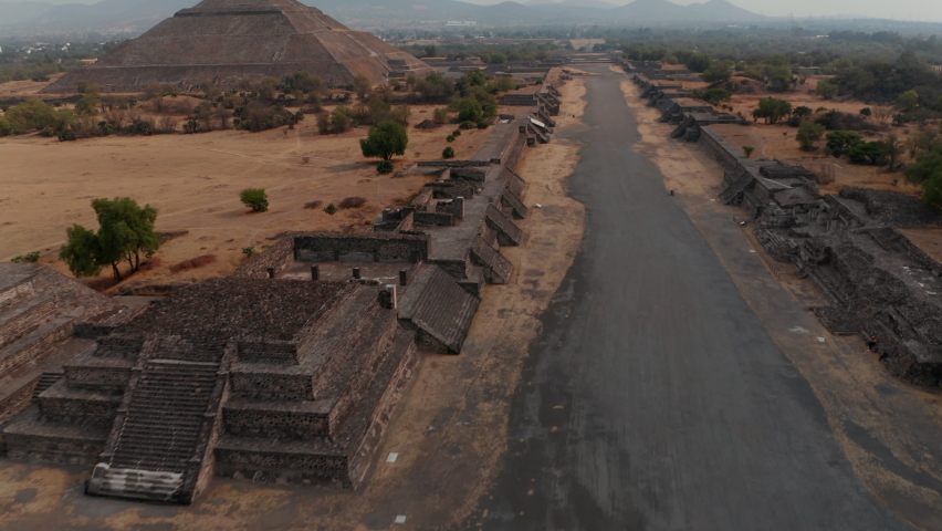 Birds eye view of Avenue of Dead and Pyramid of Sun in Teotihuacan complex, Mexico. Amazing drone view of travel destination and unesco world heritage with Temple of Sun in valley near Mexico City